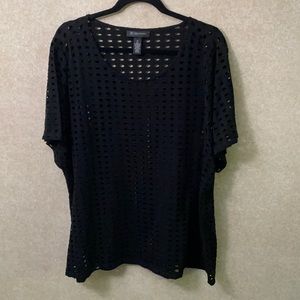 Stylish black top. Looks great with a colored tank